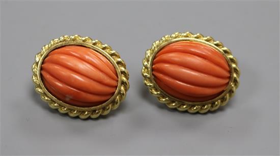 A pair of yellow metal and fluted coral oval earrings, 24mm.